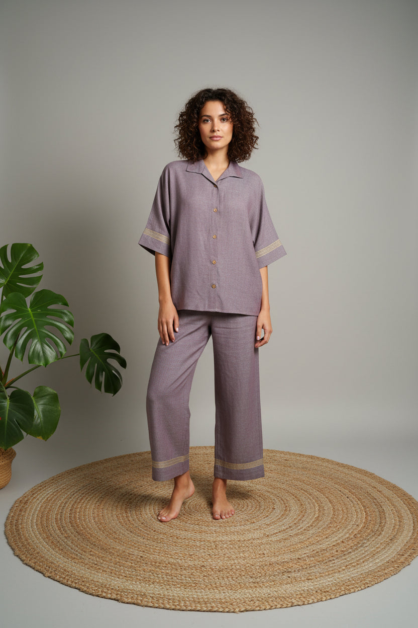 Purple outfit on a mannequin against a plain background